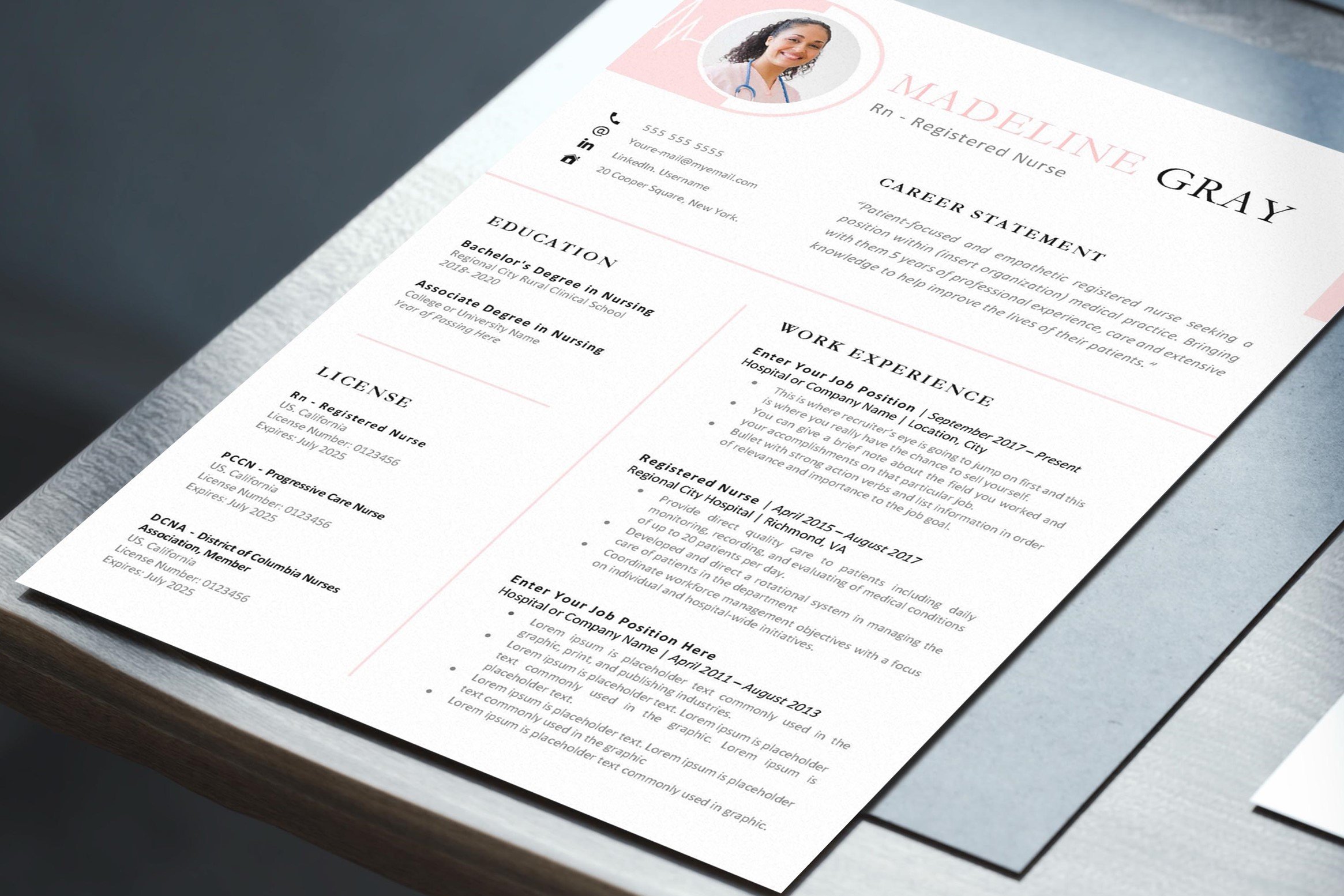 Professional resume is displayed on a table.