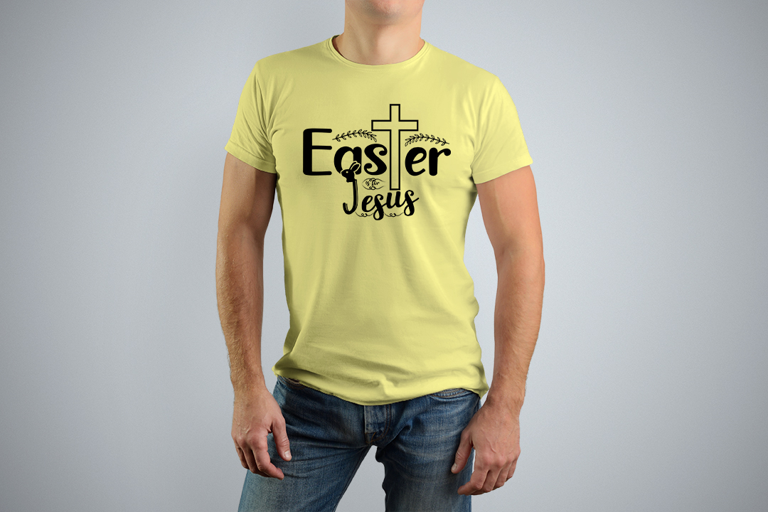 Man wearing a yellow t - shirt with a cross on it.