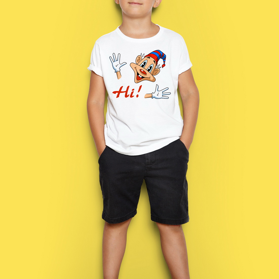 Young boy standing in front of a yellow background.