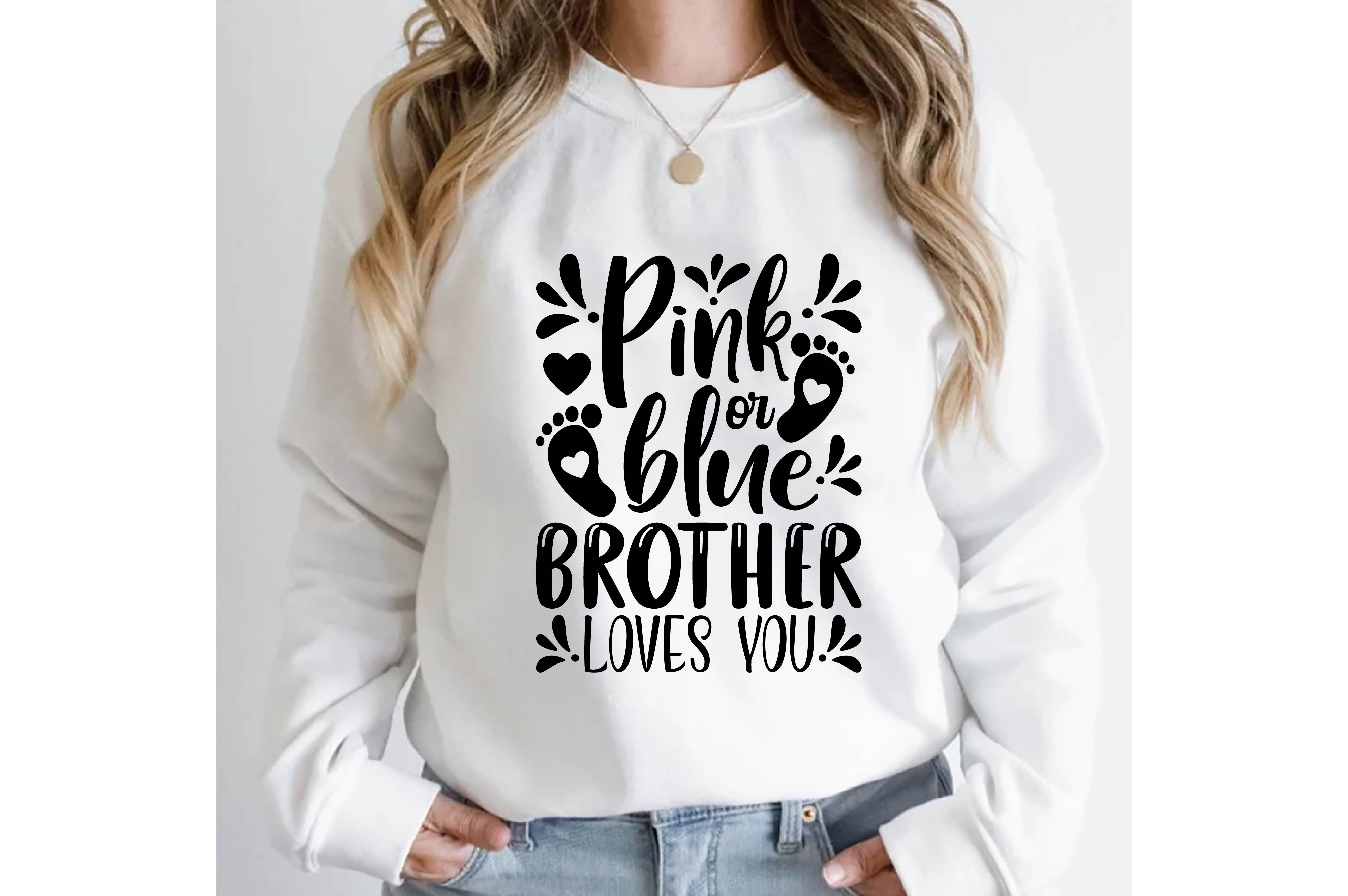 Woman wearing a sweatshirt that says pink or blue brother loves you.