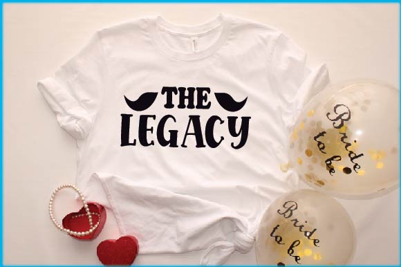 T - shirt with the words the legacy on it next to balloons.