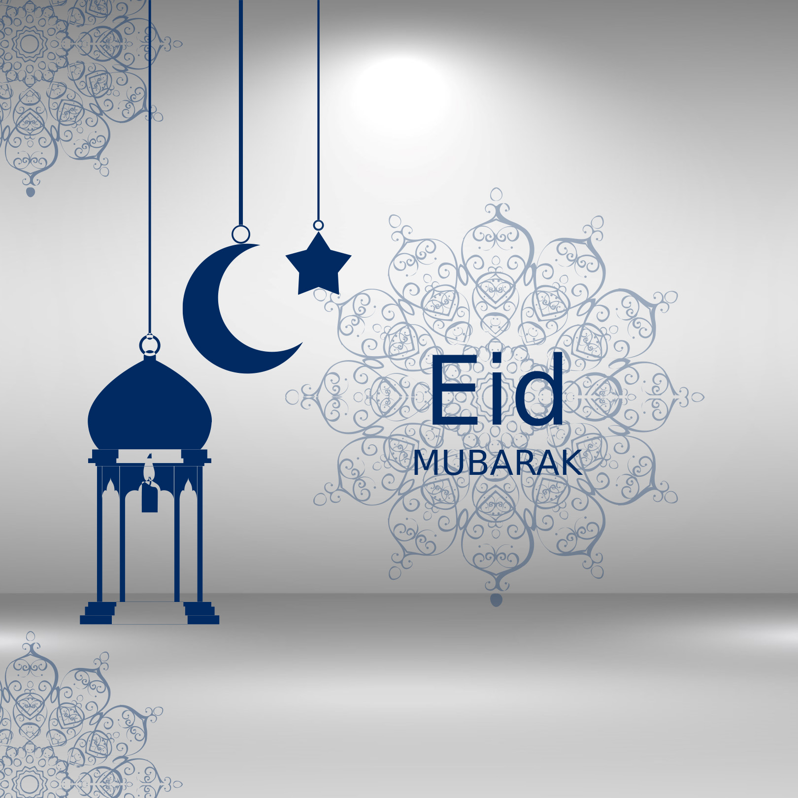Eid mubarak with a crescent and a star hanging from it.