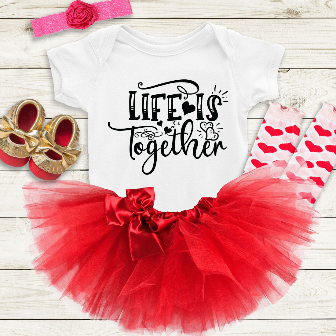 Baby girl's outfit with a red tutu and matching shoes.