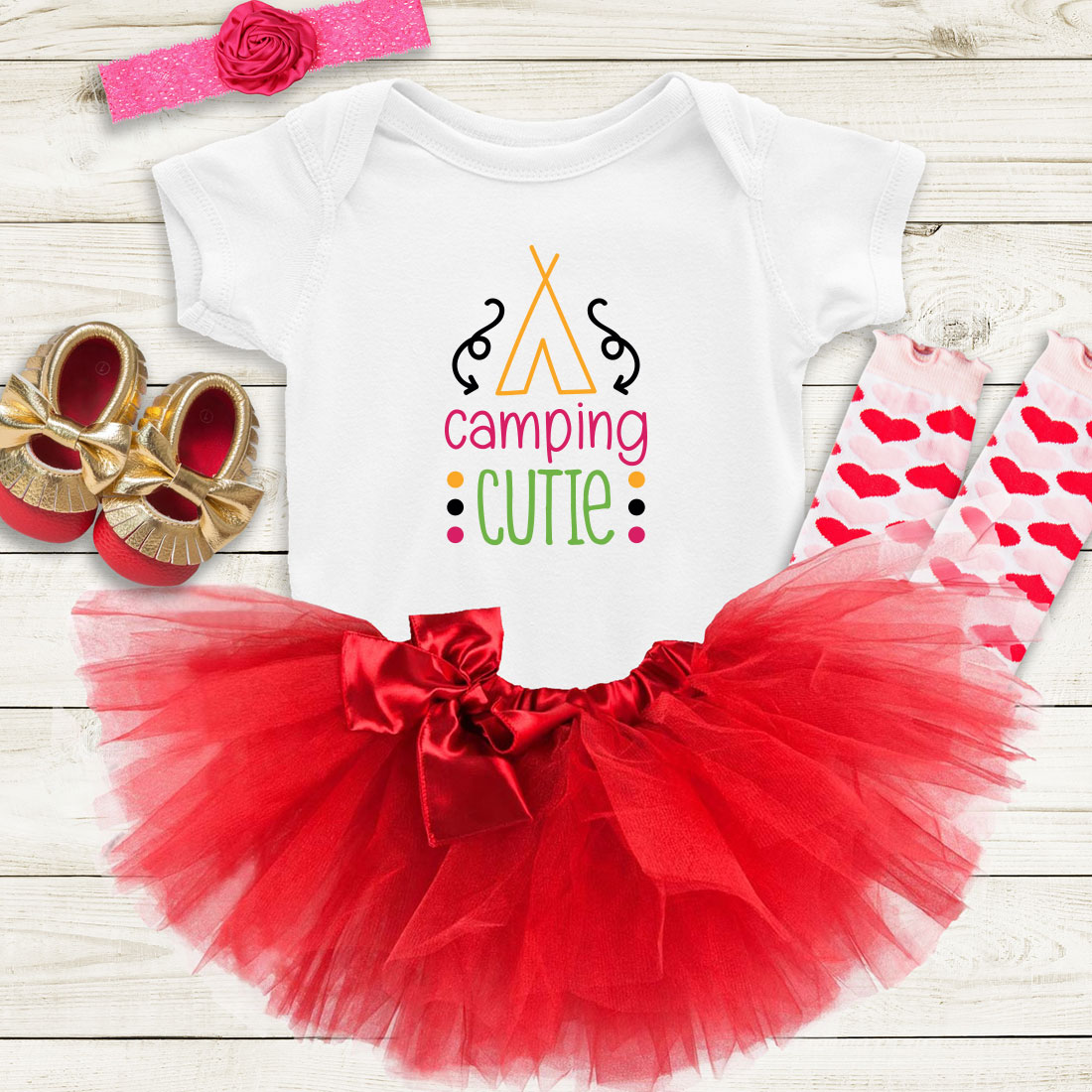 Baby girl's outfit with a red tutu and matching shoes.