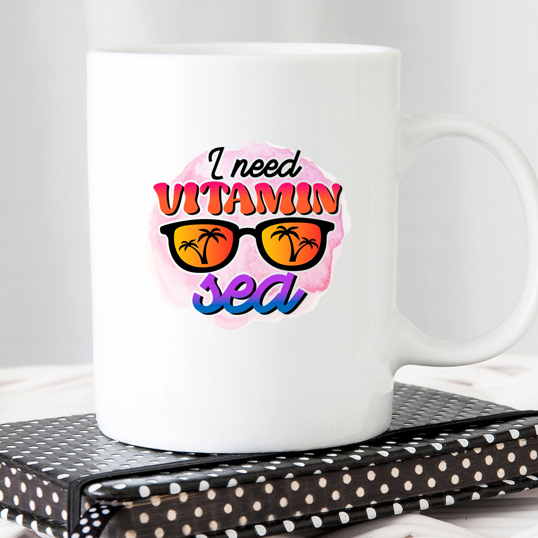 White coffee mug with the words i need vitamin sea on it.