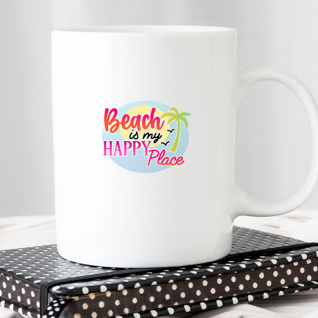 White coffee mug with the words beach is my happy place on it.