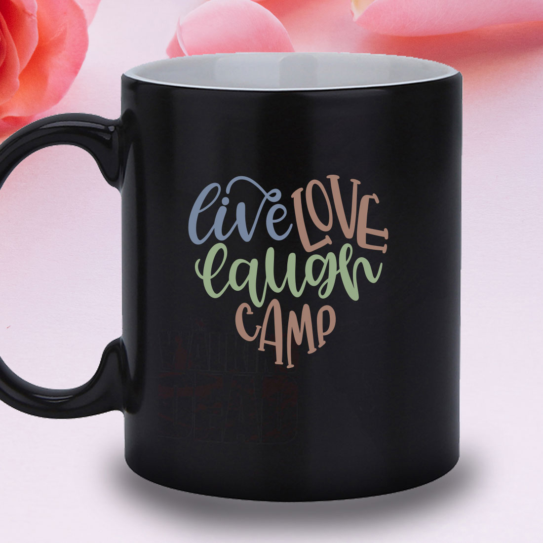 Black coffee mug with the words live love laugh camp on it.