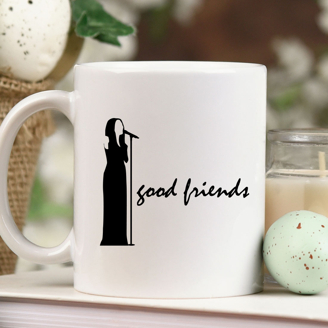 White coffee mug with the words good friends on it.