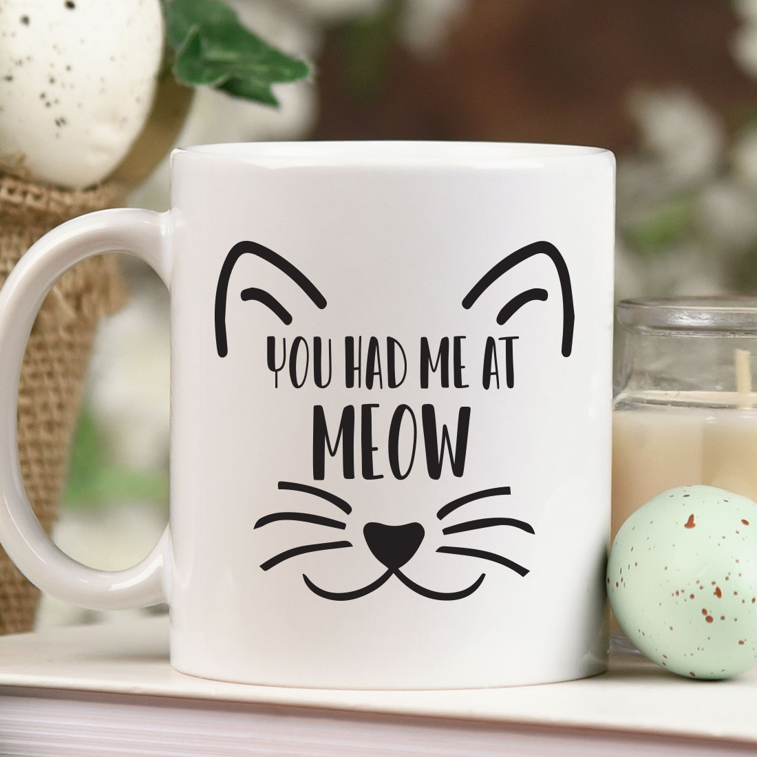 White coffee mug with a cat's face and the words you had me.