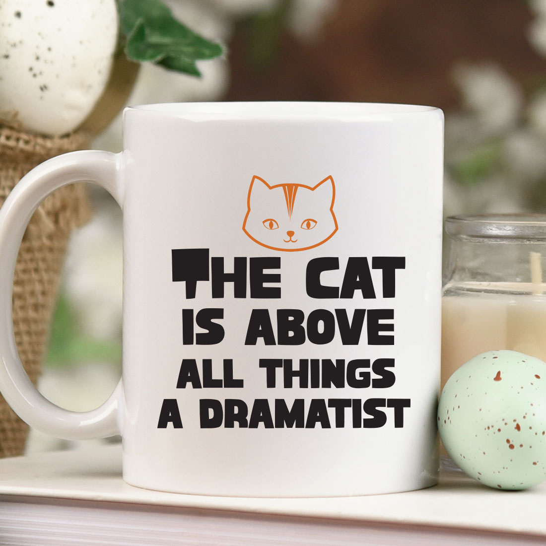 White coffee mug with the words the cat is above all things a dramatist.