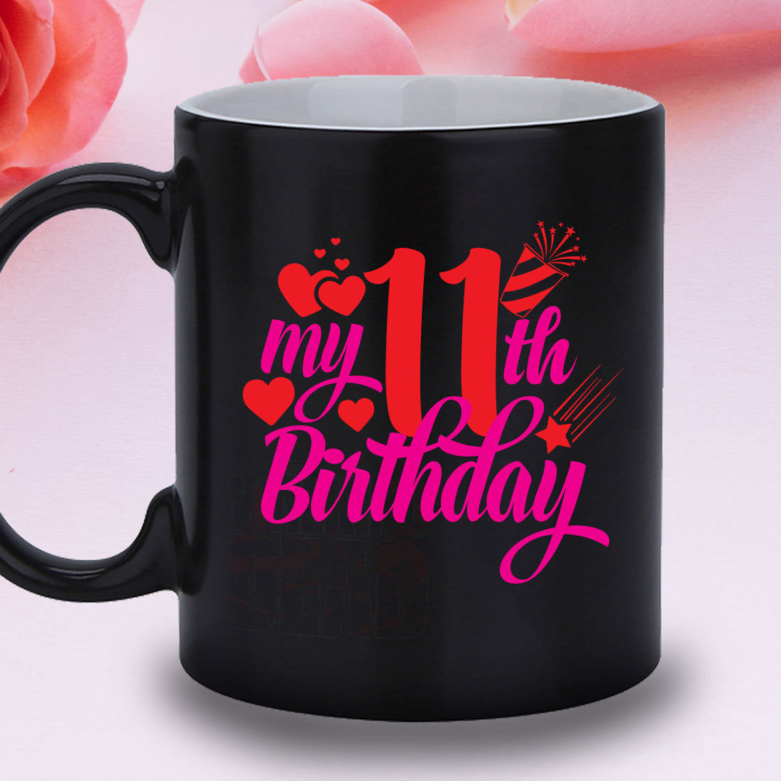 Black coffee mug with a pink number 11 on it.