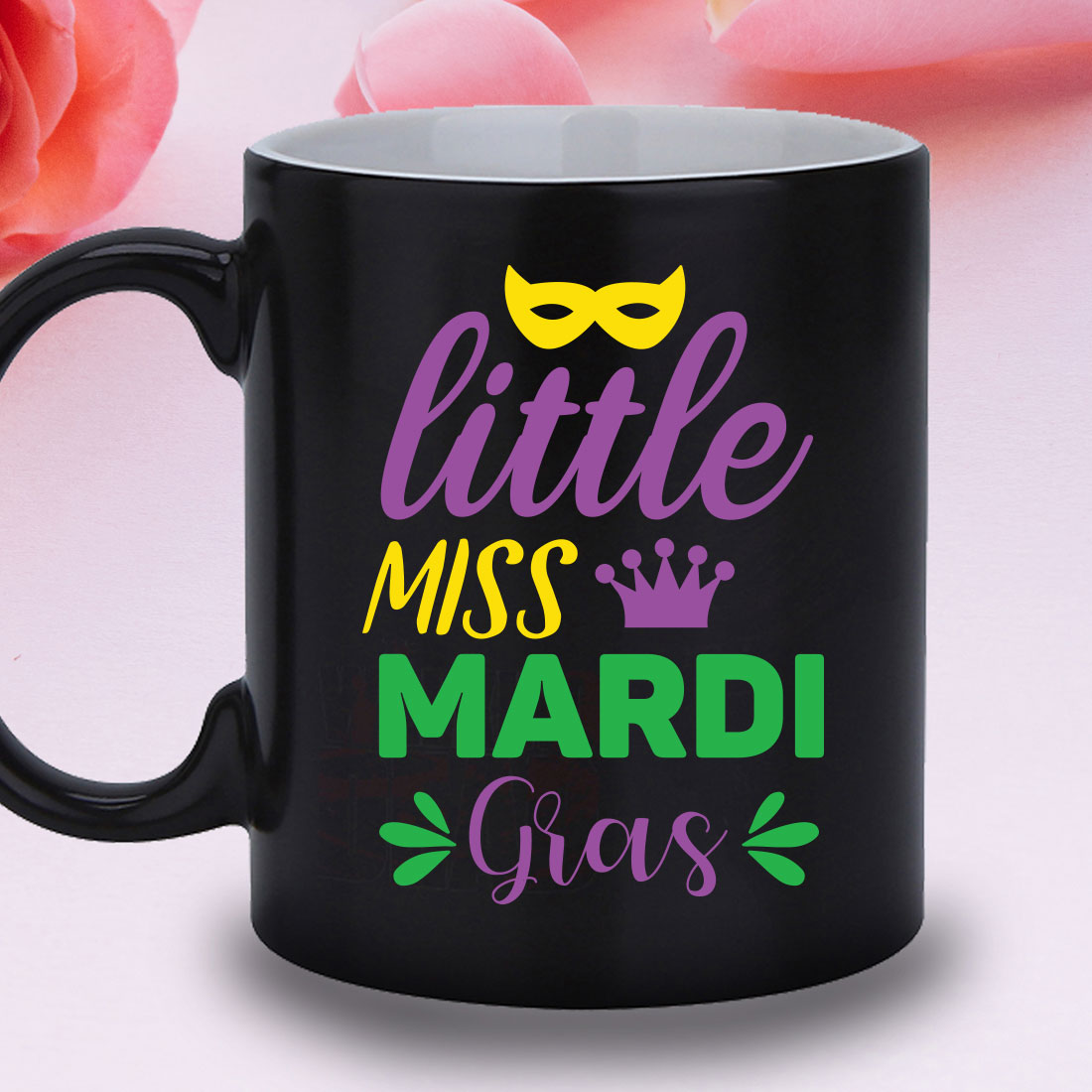 Black coffee mug with a little miss mardi gras design.
