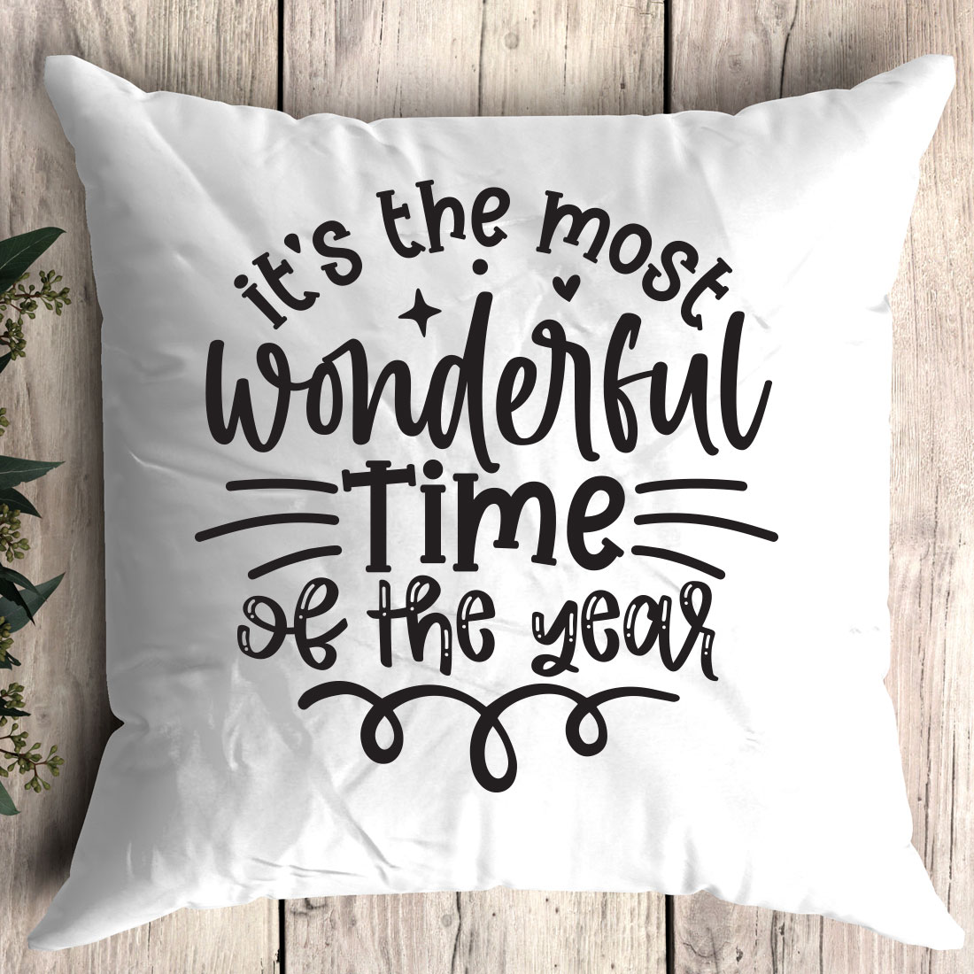 White pillow with the words it's the most wonderful time of the year.