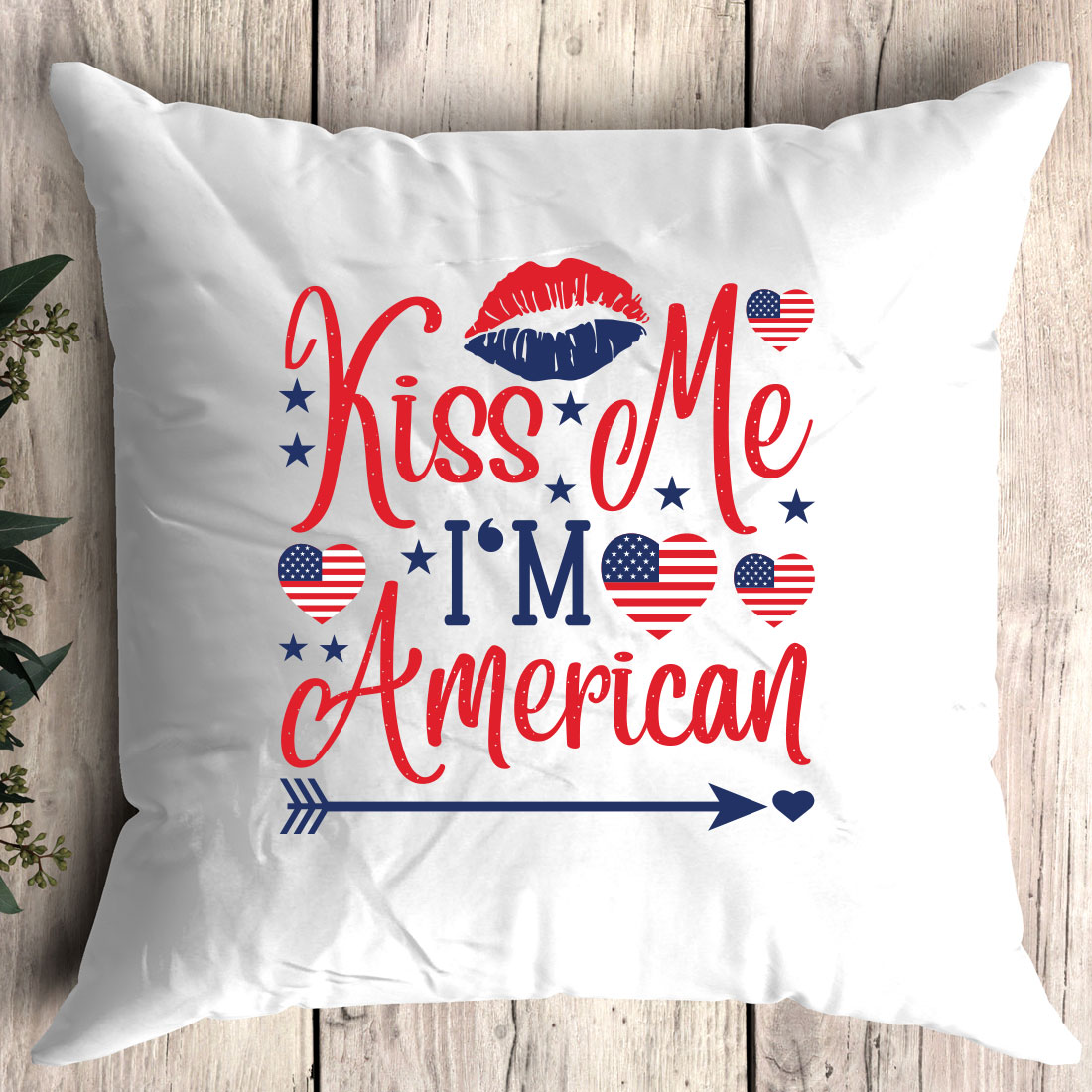 Pillow with the words kiss me i'm american on it.