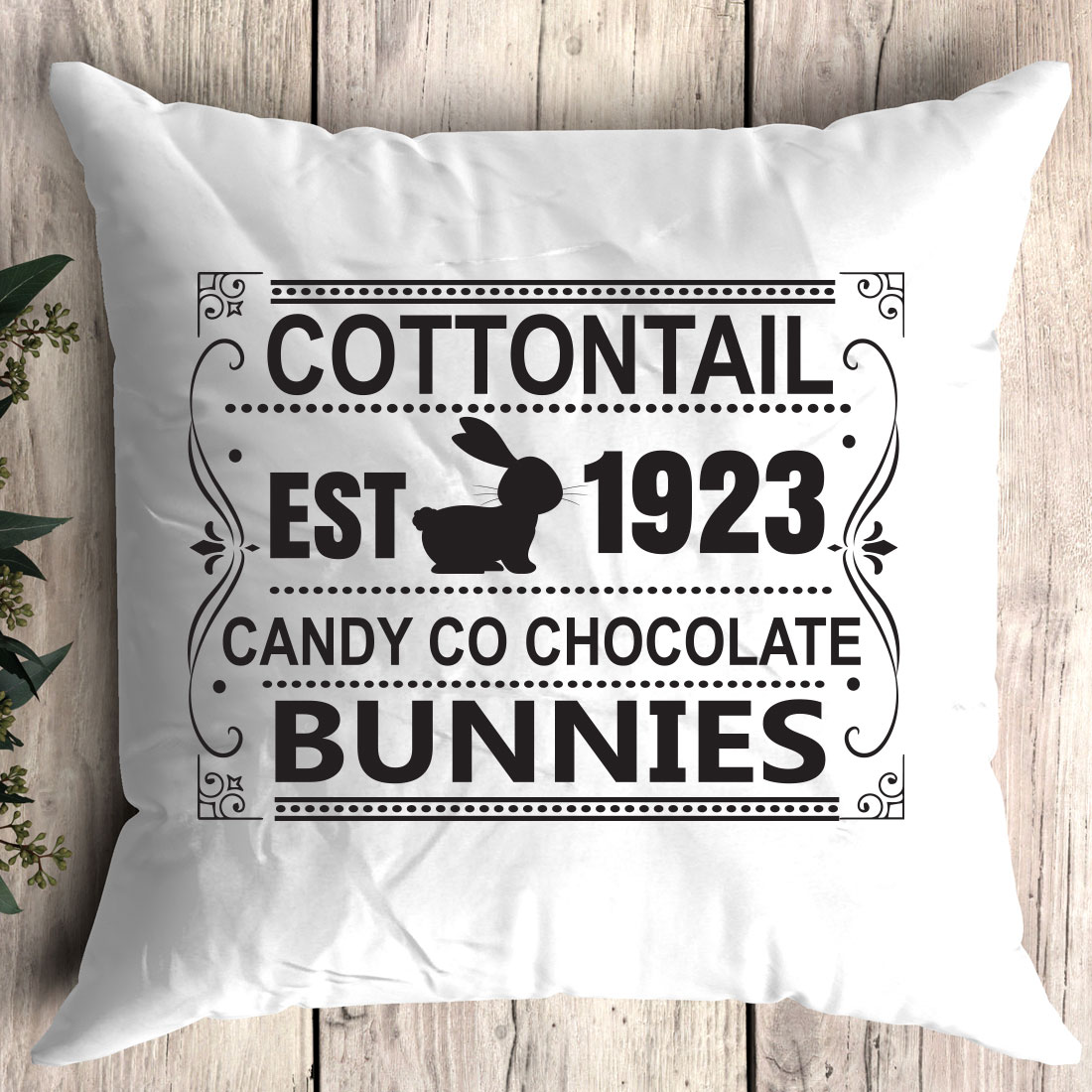 Pillow that says cottontail est 1932 candy co chocolate bunnies.