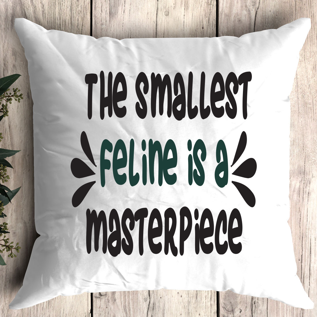 Pillow that says the smallest feline is a masterpiece.