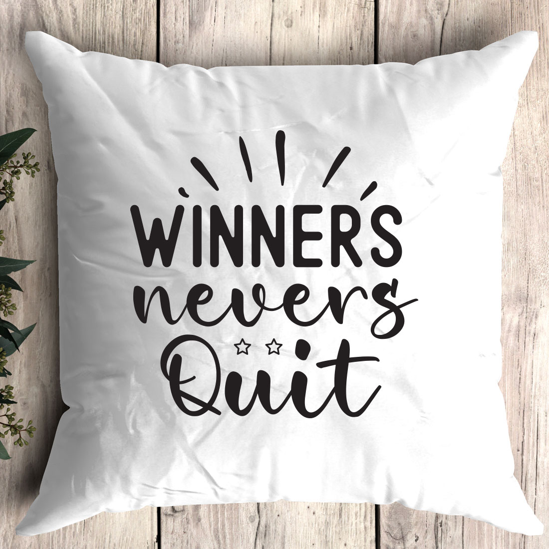 Pillow that says winners never quitt.