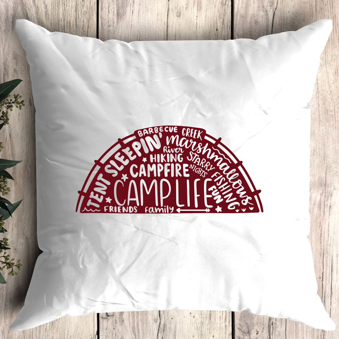 Pillow with the words camp life printed on it.