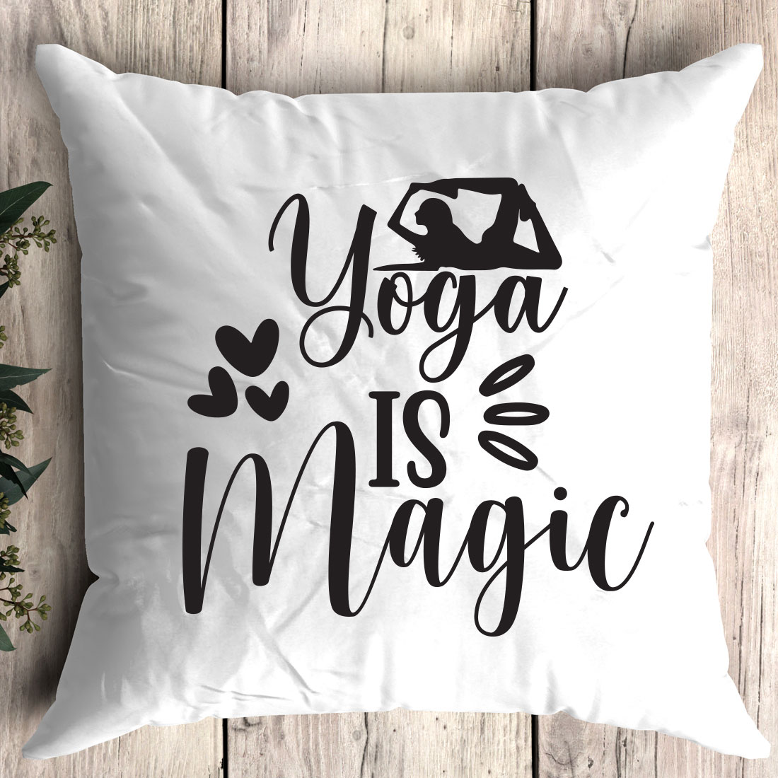 Pillow that says yoga is magic.