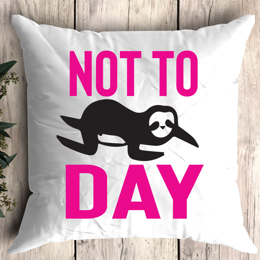 White pillow with a pink print on it that says not to day.