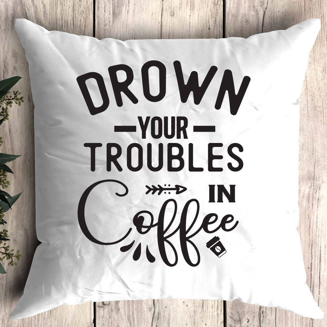 Pillow that says drown your troubles in coffee.