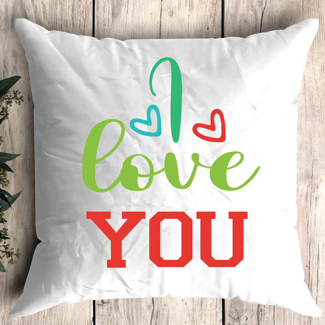 Pillow with the words i love you on it.