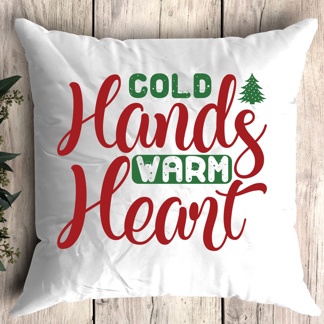 White pillow with the words cold hands warm heart on it.