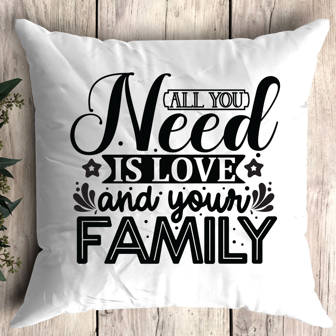 Pillow that says all you need is love and your family.