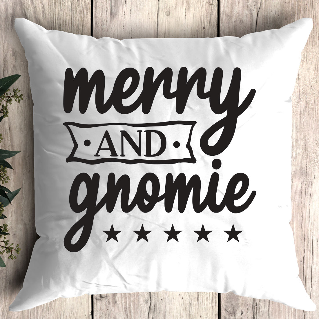 Pillow that says merry and gnomie on it.