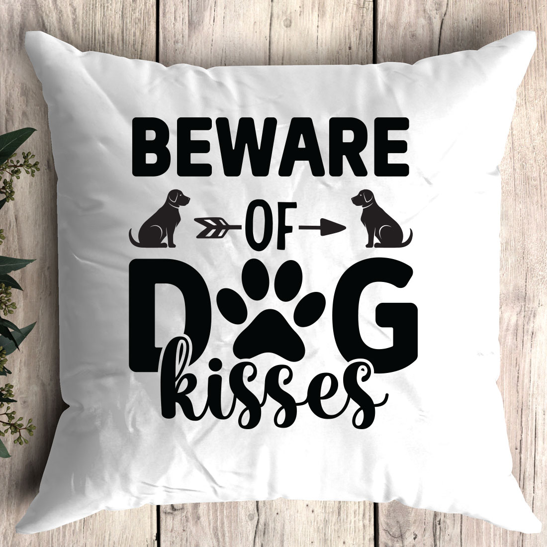 Pillow that says beware of dog kisses.