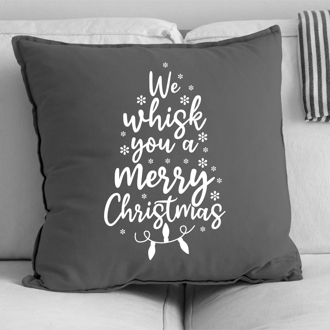 Black and white pillow with a christmas tree on it.