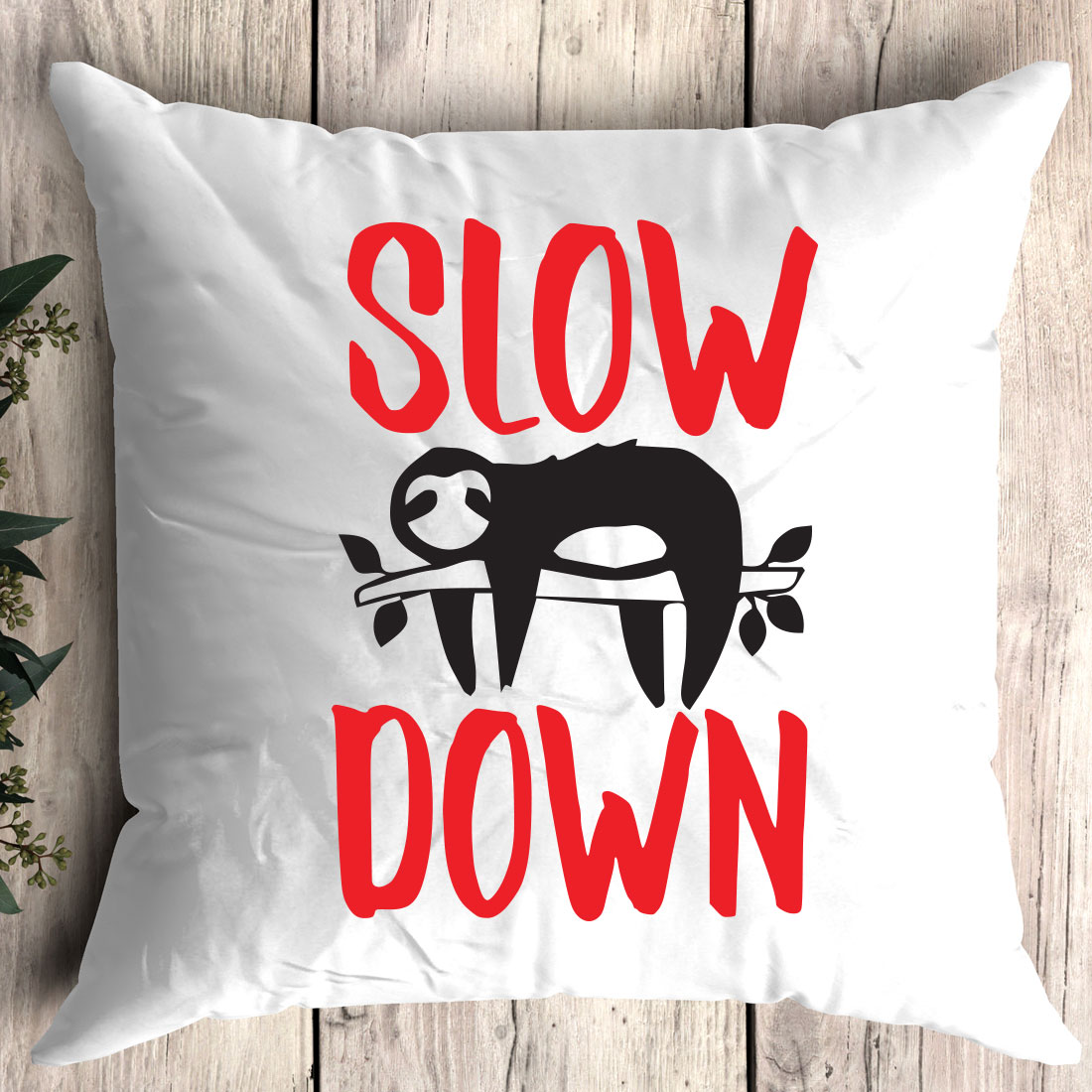 Pillow that says slow down on it.