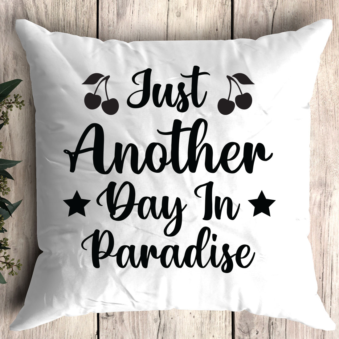 Pillow that says just another day in paradise.