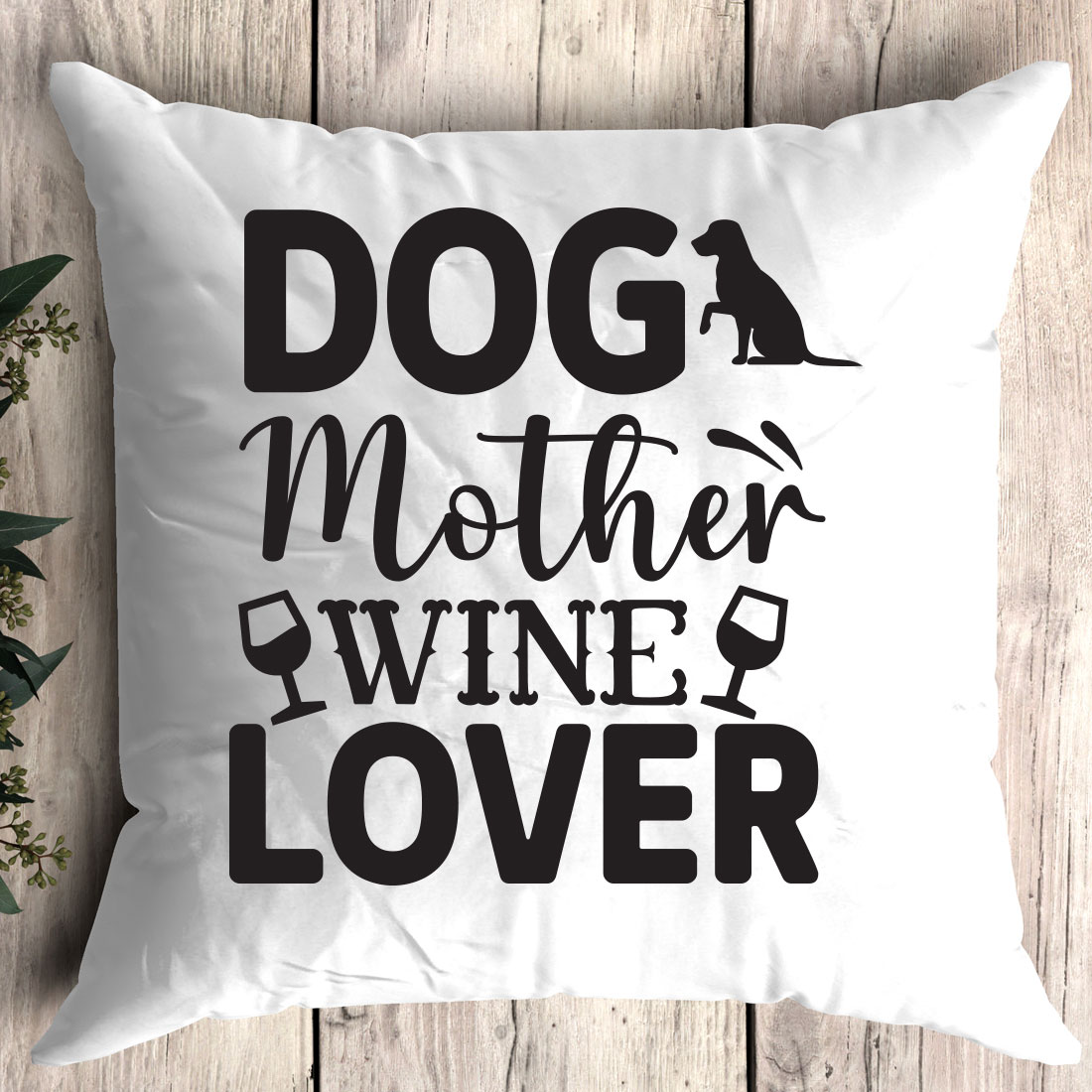 White pillow that says dog mother wine lover.