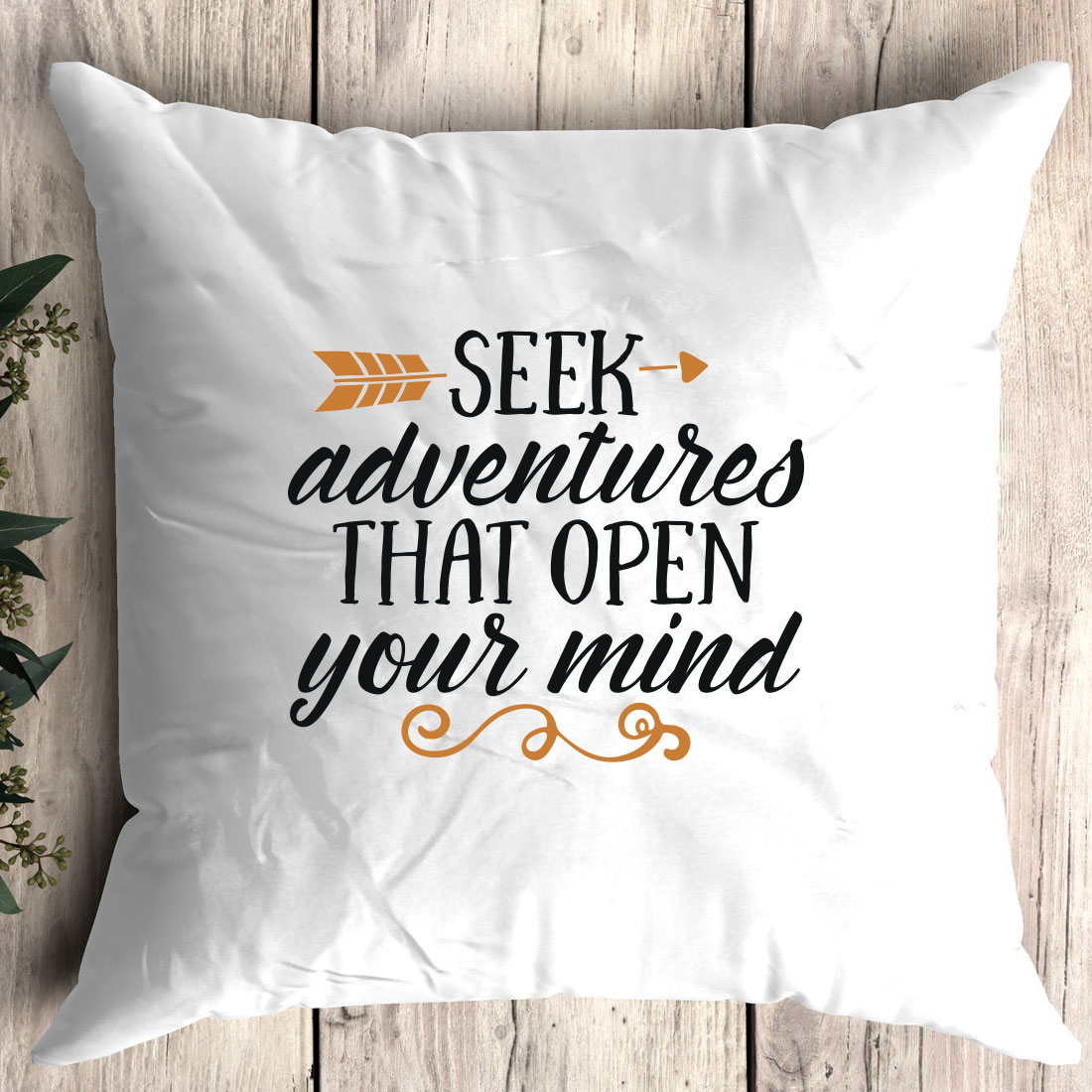 White pillow with the words seek adventures that open your mind.