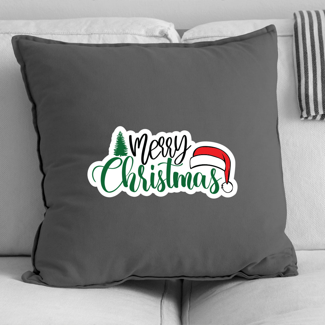Grey pillow with a merry christmas message on it.