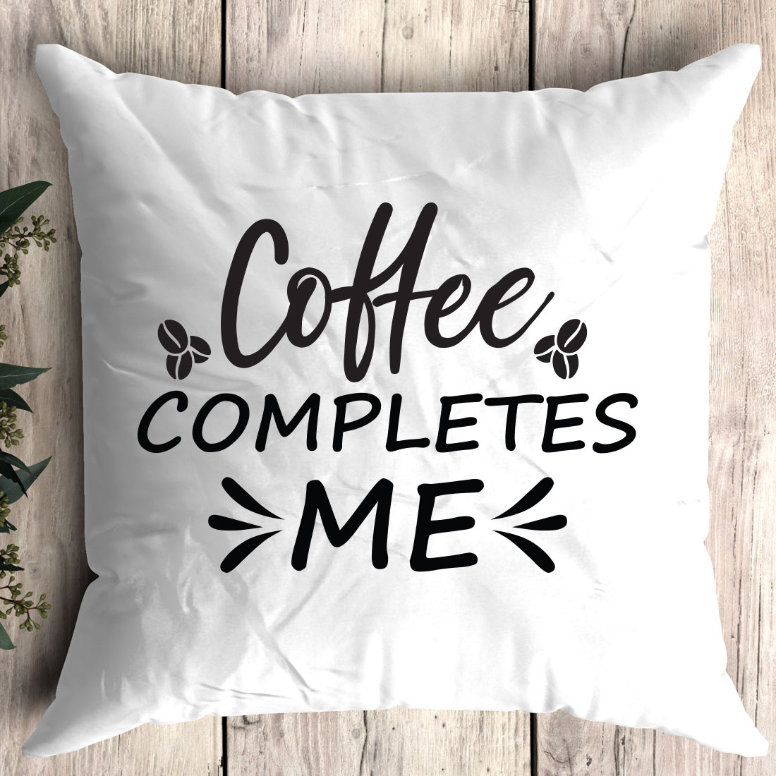 White pillow with the words coffee completes me on it.