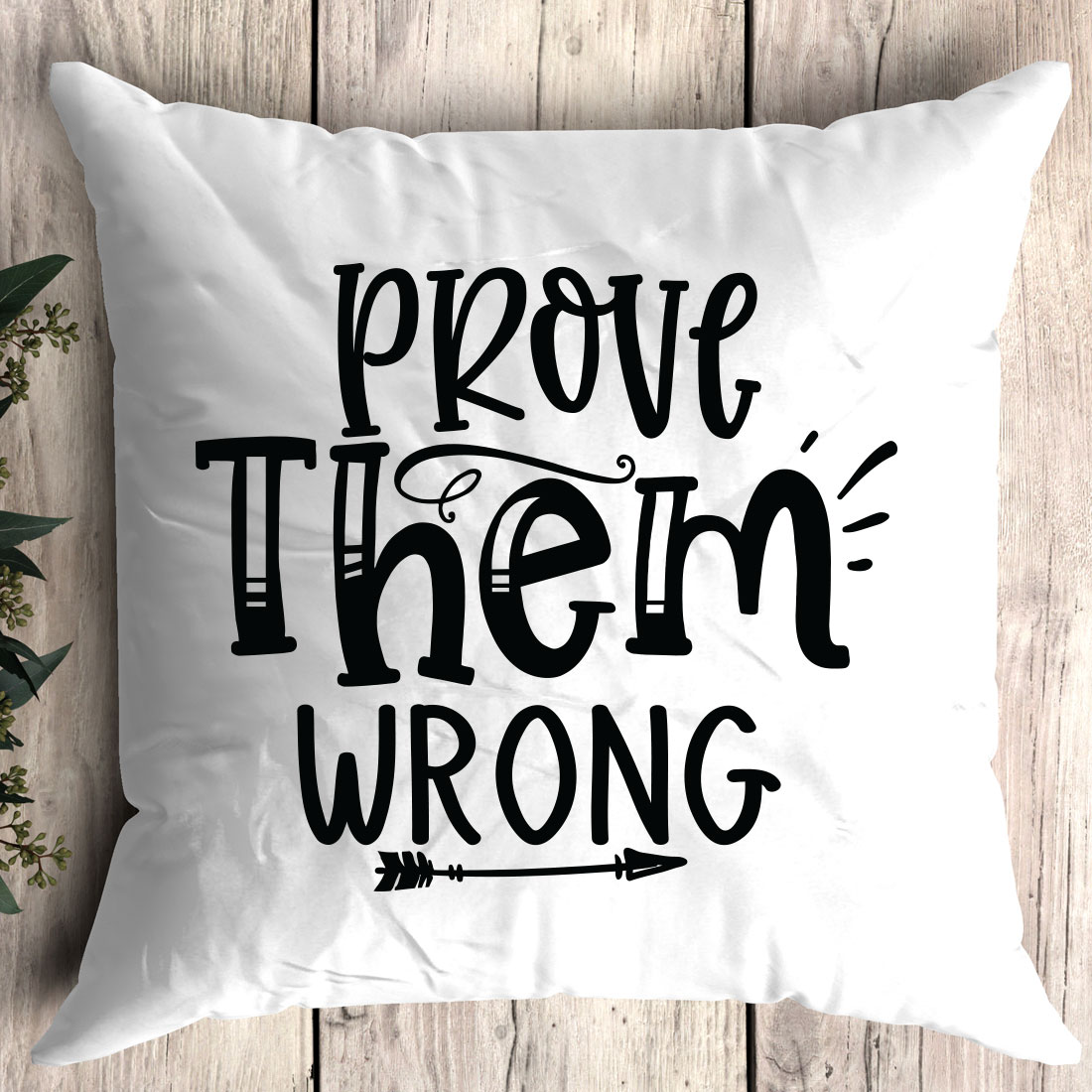 Pillow with the words prove them wrong on it.