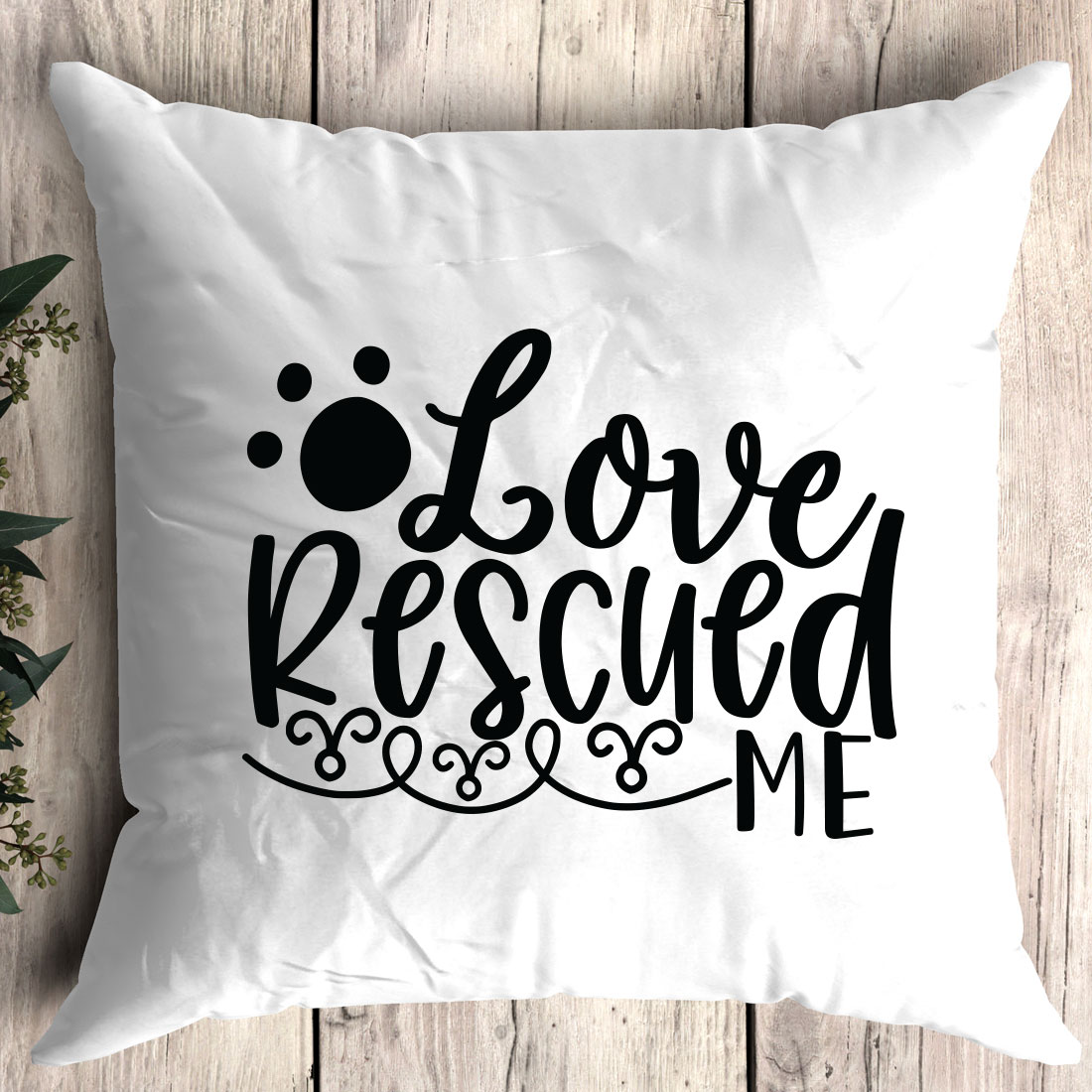 White pillow with the words love rescue me on it.