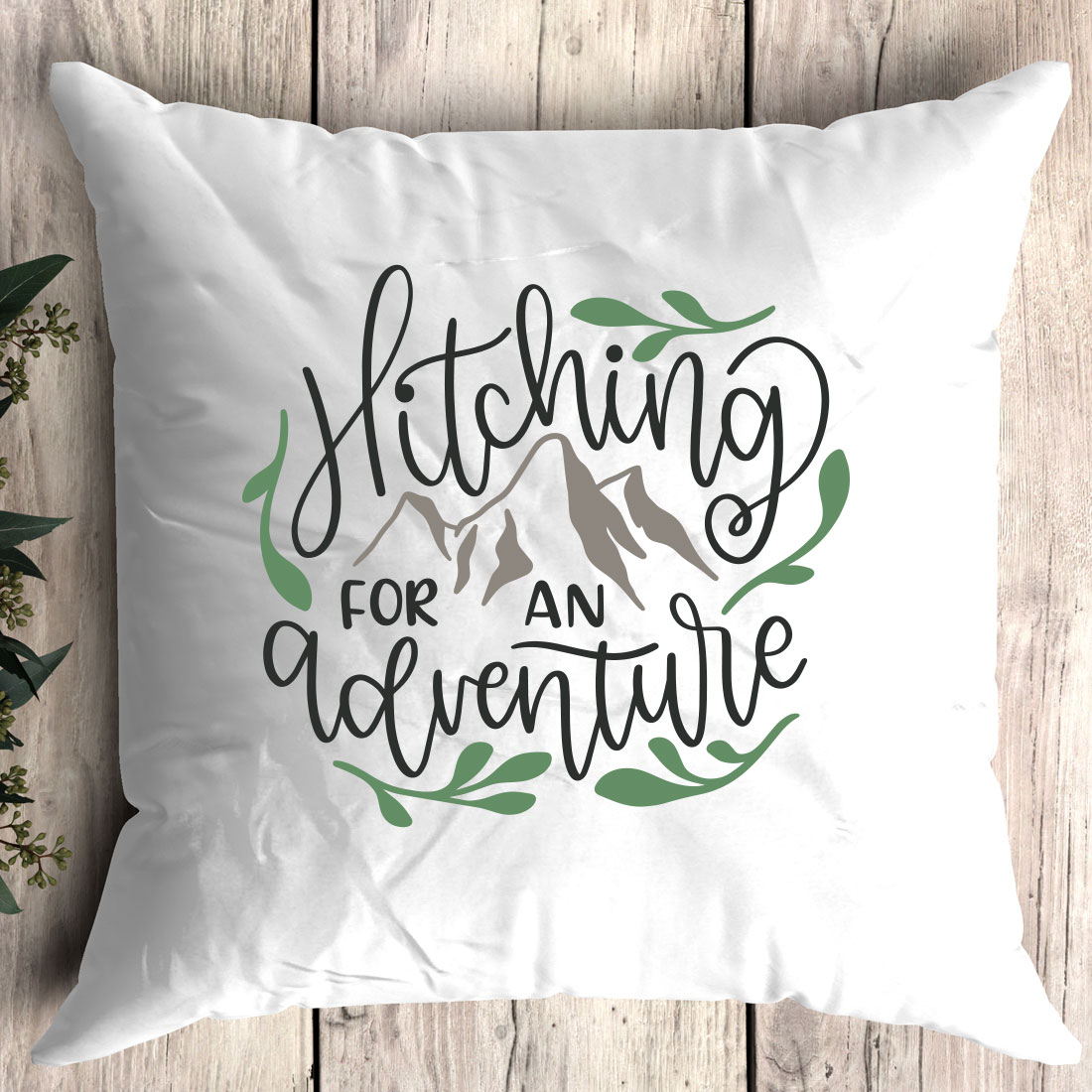 White pillow with the words pitching for an adventure printed on it.