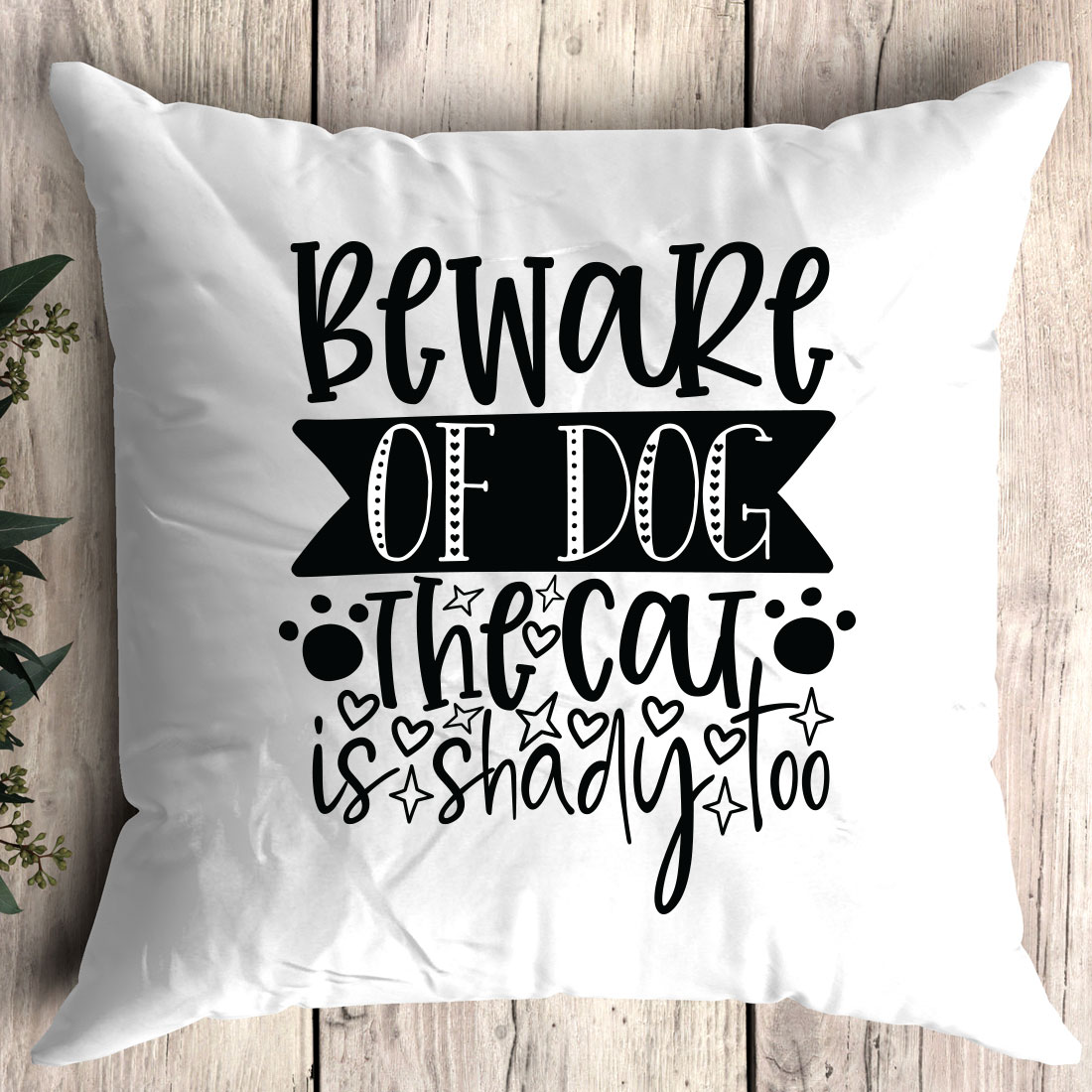 Pillow that says beware of dog the cat is shady.