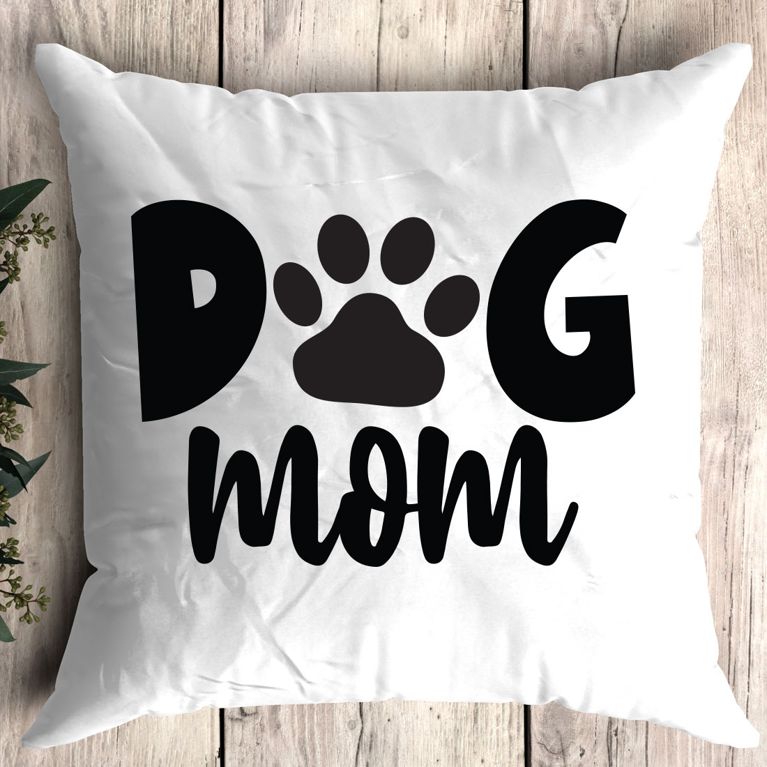 Dog mom pillow with a paw print on it.