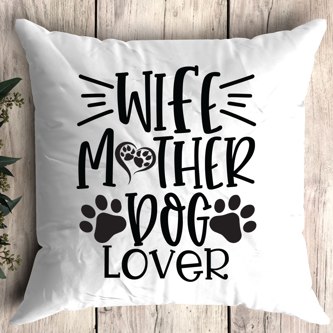 White pillow with a dog paw print on it.