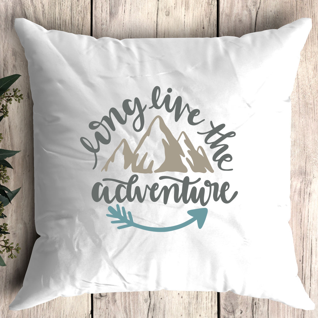 Pillow with the words enjoy the adventure on it.