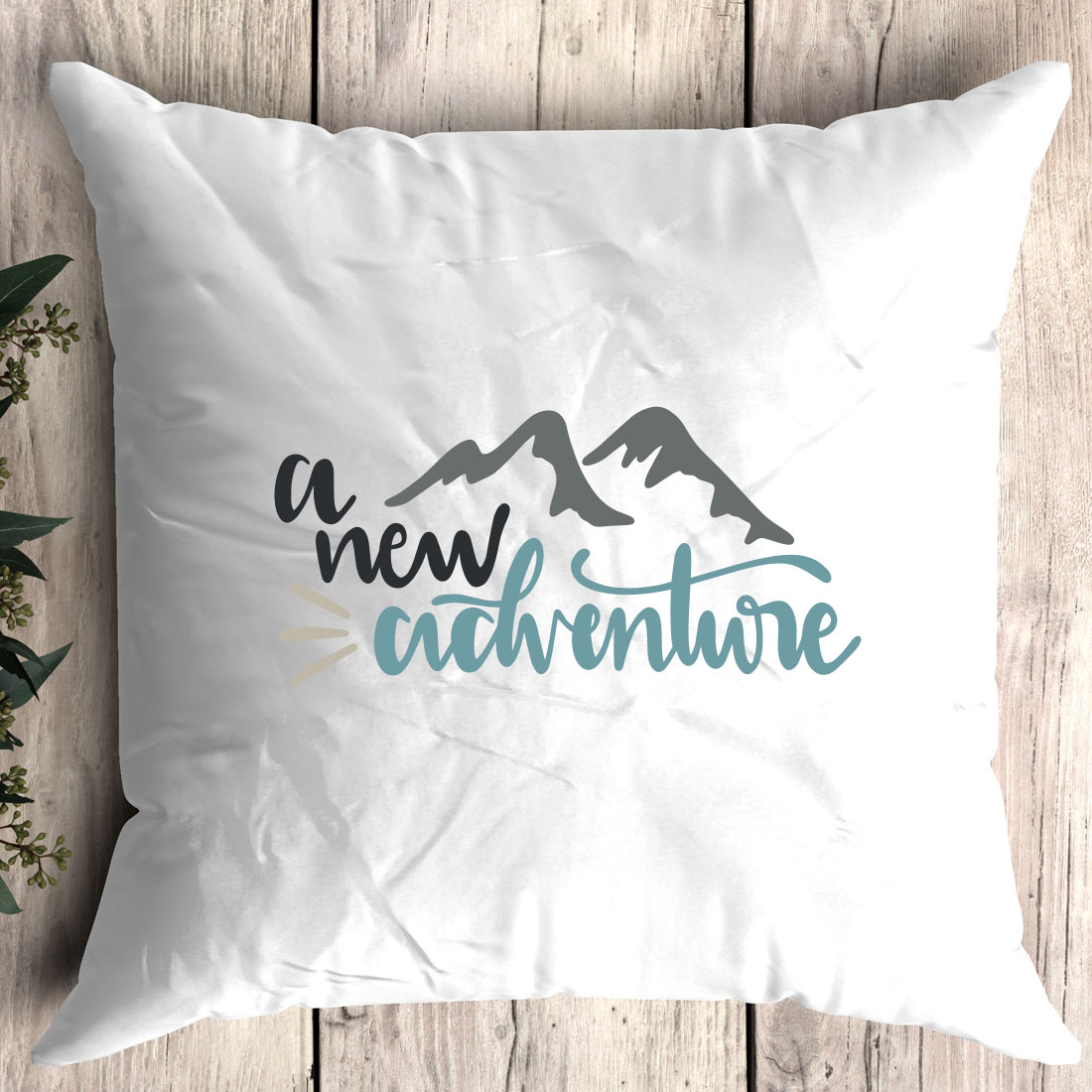 Pillow with the words a new adventure printed on it.