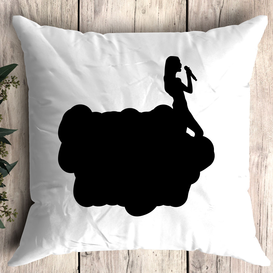 Pillow with a silhouette of a woman on it.