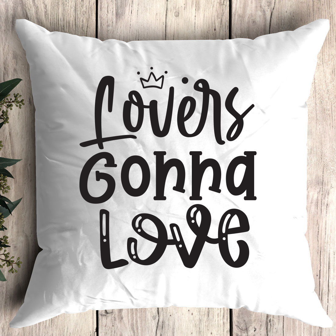 White pillow with the words love is going love on it.