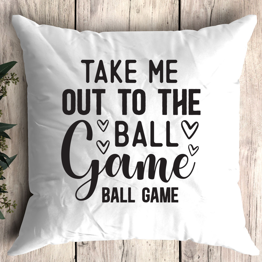 Pillow that says take me out to the ball game.