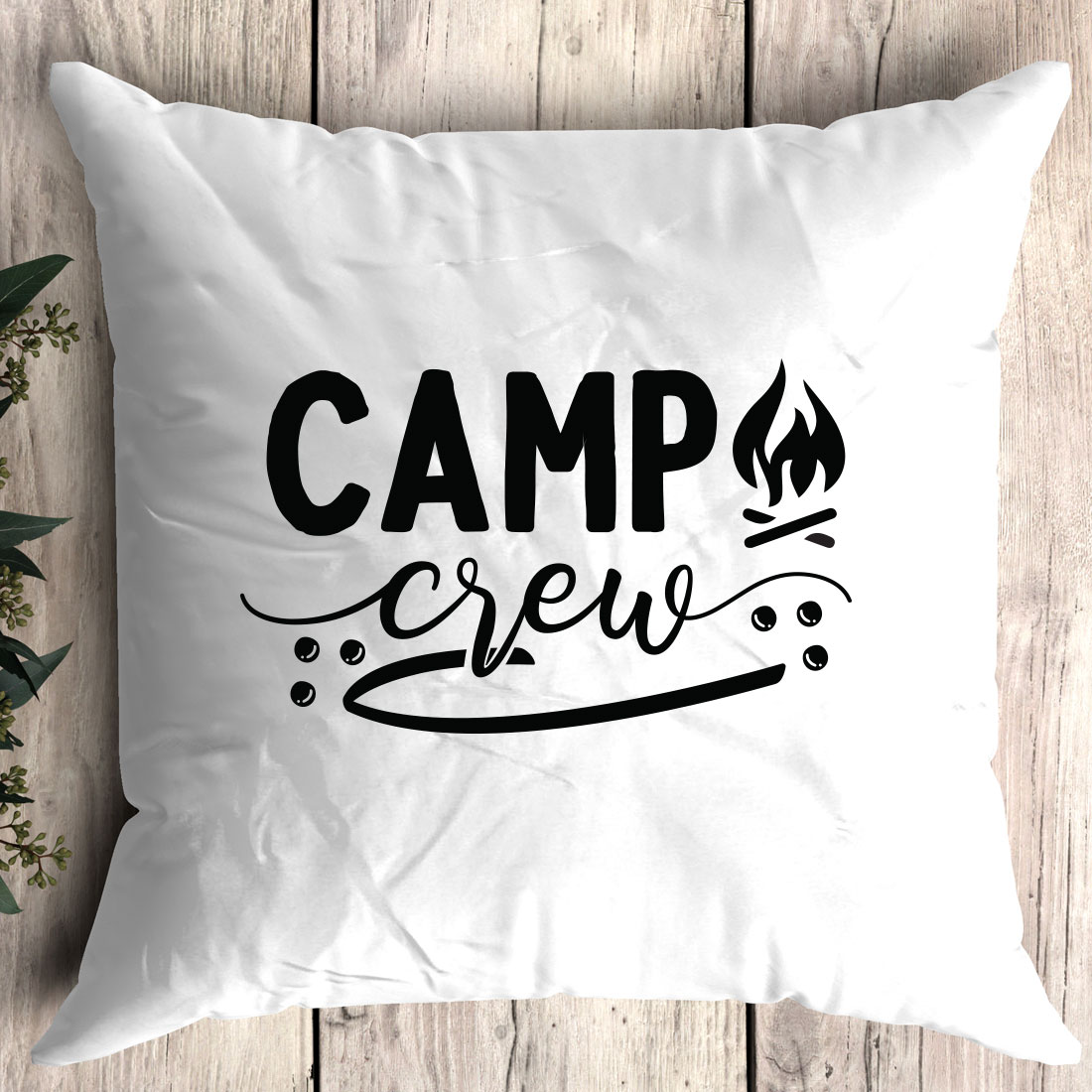 Pillow that says camp crew on it.