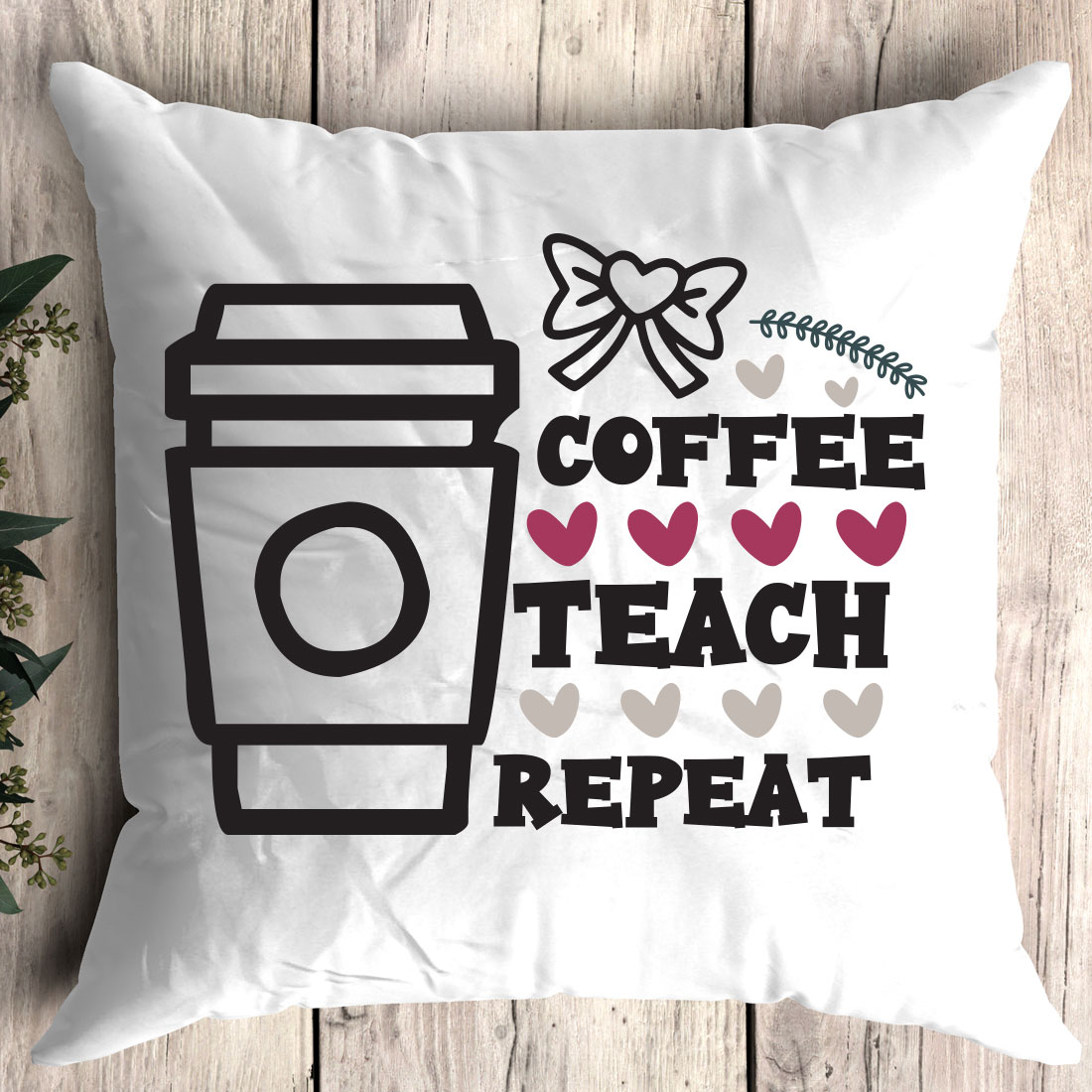 White pillow with coffee teach repeat on it.